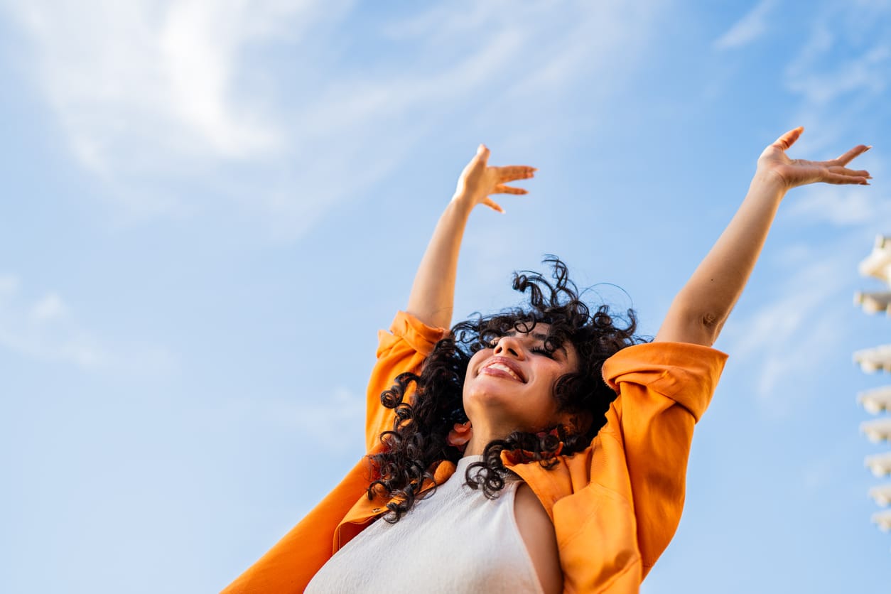 Carefree woman enjoying sunny day outdoors